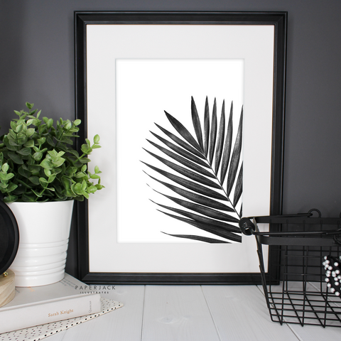 black and white palm leaf print on white background by paperjack illustrates