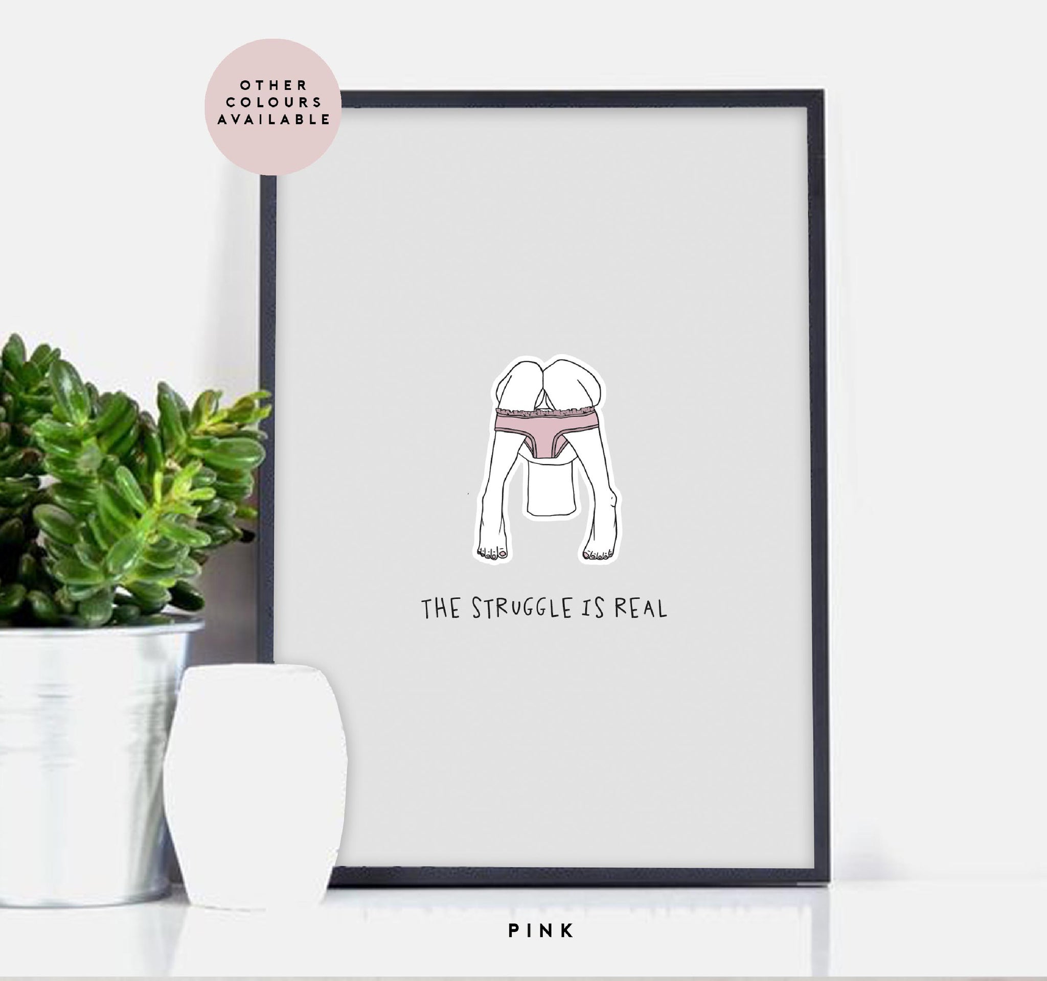 'The Struggle Is Real' female illustration bathroom print. Funny and humorous bathroom wall art of man sitting on the toilet reading a newspaper.